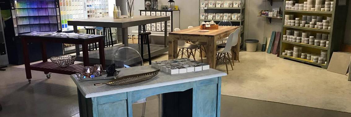 Paint and DIY supplies displayed in a workshop and retail store interior