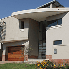 Modern painted house exterior with textured finish